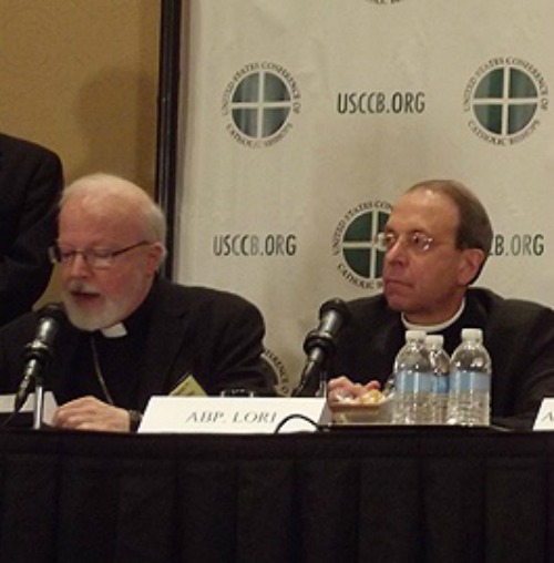 Cardinal Sean O'Malley (l) and Archbishop William Lori speak at a 2012 USCCB conference.
