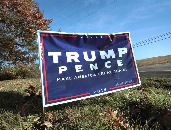 A campaign sign showing support for President-elect Donald Trump sits along a rural highway on Nov. 9 near Belvidere, Illinois. Below, Trump and his campaign manager, Kellyanne Conway, a Catholic.