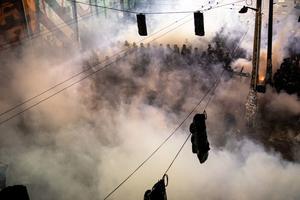 Tear gas fills the air as demonstrators clash with police near the Seattle Police Department’s East Precinct on June 8.