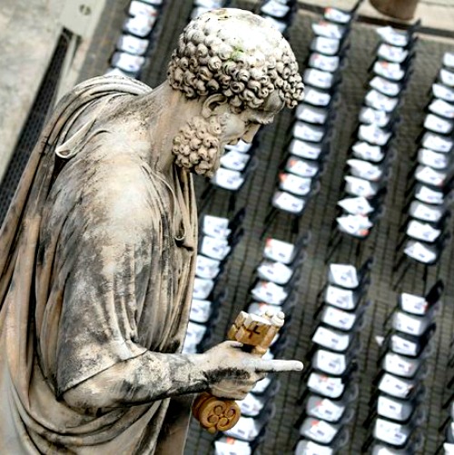 The statue of St. Peter looms over the square named for him in the Vatican.
