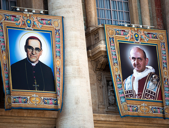 Special banners with the official portraits of Pope Paul VI and Archbishop Óscar Romero hang on the facade of St. Peter's Basilica before the Oct. 14 Canonization Mass.
