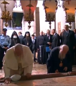 Pope Francis and Ecumenical Patriarch Bartholomew kneel together in prayer at the Basilica of the Holy Sepulchre in Jerusalem on May 25.