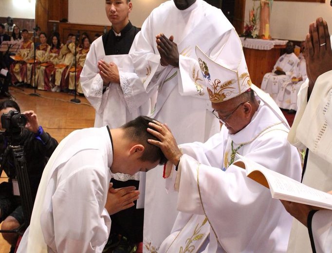 Above, Bishop Wenceslao Selga Padilla ordains Father Joseph Enkh-Baatar; below, Father Enkh-Baatar offers blessings.