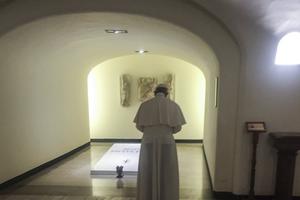 Pope Francis prays at the tomb of Blessed Paul VI beneath St. Peter’s Basilica Aug. 6. 