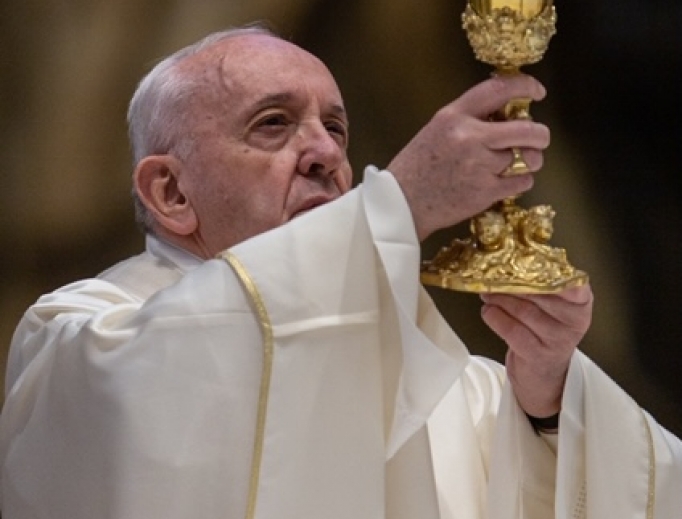 Pope Francis raises the chalice during the Solemn Mass of the Lord's Supper on April 9, 2020. 