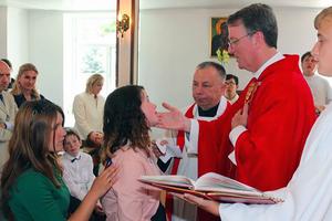  Father Anthony Corcoran presides at a confirmation in Bishkek cathedral. 