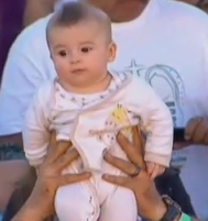 A baby attends final Mass in Mexico with Pope Francis on Feb. 17.