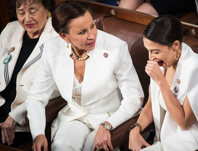 Rep. Alexandria Ocasio-Cortez (R) and other representatives are seen as President Donald Trump delivers the State of the Union address at the U.S. Capitol in Washington, D.C., on Feb. 5, 2019.