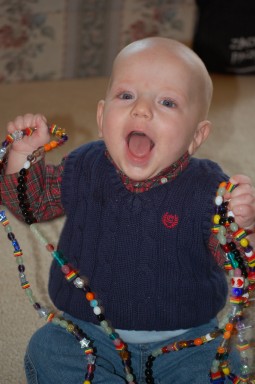 James holds a 14-foot-long strand of colorful beads, each with a color-coded meaning, that record the days he spent in the hospital.  A beautiful, glass, heart-shaped bead marks the day James received his new heart.