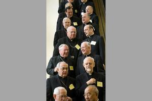 Bishops from around the United States ride an escalator during the fall meetings of the U.S. Conference of Catholic Bishops.