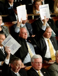 IMAGE BATTLE. Congressional Republicans silently held up their health care reform plans when Obama addressed them Sept. 9.
