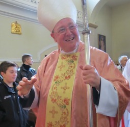 Cardinal Timothy Dolan enters Nostra Signora di Guadalupe Church in Rome March 10.