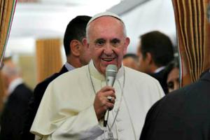 Pope Francis speaks to journalists aboard the papal plane during the flight from Baku to Rome, Oct. 2.