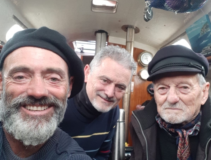 Juan Manuel Ballestero with his brother and father after the voyage.