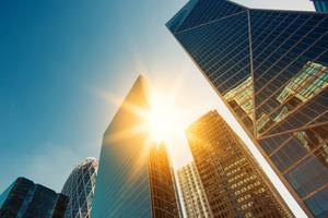 Sun hitting buildings in the business center of Paris. 