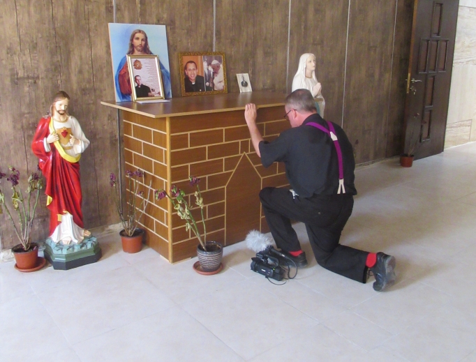 Father Benedict Kiely prays at the tomb in Karamlesh of Chaldean Father Ragheed Ganni, who was martyted in 2007; below, he meets with Chaldean Archbishop Bashar Warda of Erbil and  Yazidi spiritual leader Baba Sheikh (c) and Qaraqosh Syriac Catholic native Yohanna Towaya (l).


