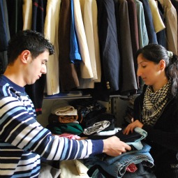 NEW HOME? Sarmad and Sandra assign donated clothes for refugee families, at the KADER office in Istanbul.