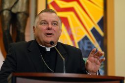 PRESS CONFERENCE. Archbishop Thomas Wenski gestures during an April 20 press conference in Orlando, Fla., held to announced his appointment as the fourth archbishop of Miami. The new archbishop, head of the Orlando Diocese since 2004, succeeds Archbishop John C. Favalora, 74, who has been in Miami since 1994.