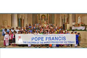 Above, Cardinal Donald Wuerl of Washington with the children who participated in the live 11th Worldwide Children’s Eucharistic Holy Hour. 
Below, Father Patrick Byrne, previous general secretary of the Pontifical Holy Childhood Association, in the Basilica of the National Shrine of the Immaculate Conception in Washington. The five children are representing the World Mission Rosary from Africa, America, Europe, Oceania and Asia.
