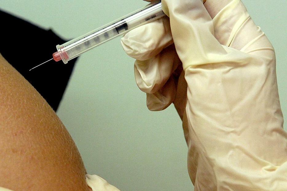 14-year-old girl gets HPV vaccine.