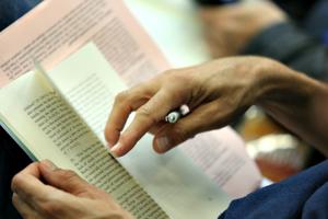A journalist looks over a copy of Pope Francis' post-synodal apostolic exhortation 'Amoris Laetitia' (The Joy of Love) at a press conference for the document on April 8.