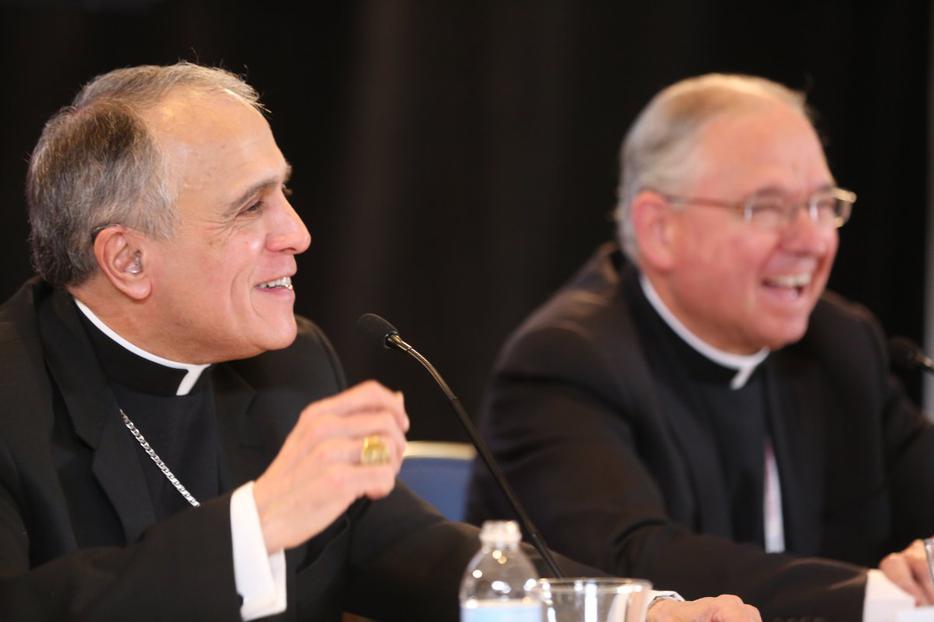 Cardinal Daniel DiNardo (l.) and Archbishop Jose Gomez, president and vice-president of the USCCB at the spring meeting in Indianapolis.