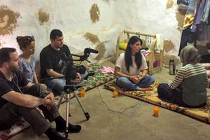 Helma Adde, 38, from Long Island, N.Y., interviews a Yazidi woman, who was kidnapped in Iraq by the Islamic State and escaped, in the new documentary 'Our Last Stand.' Below, St Mary's Church, bombed on Easter Sunday by the Islamic State in Syria, where the Christian faith goes back to the time of Christ and the apostles.