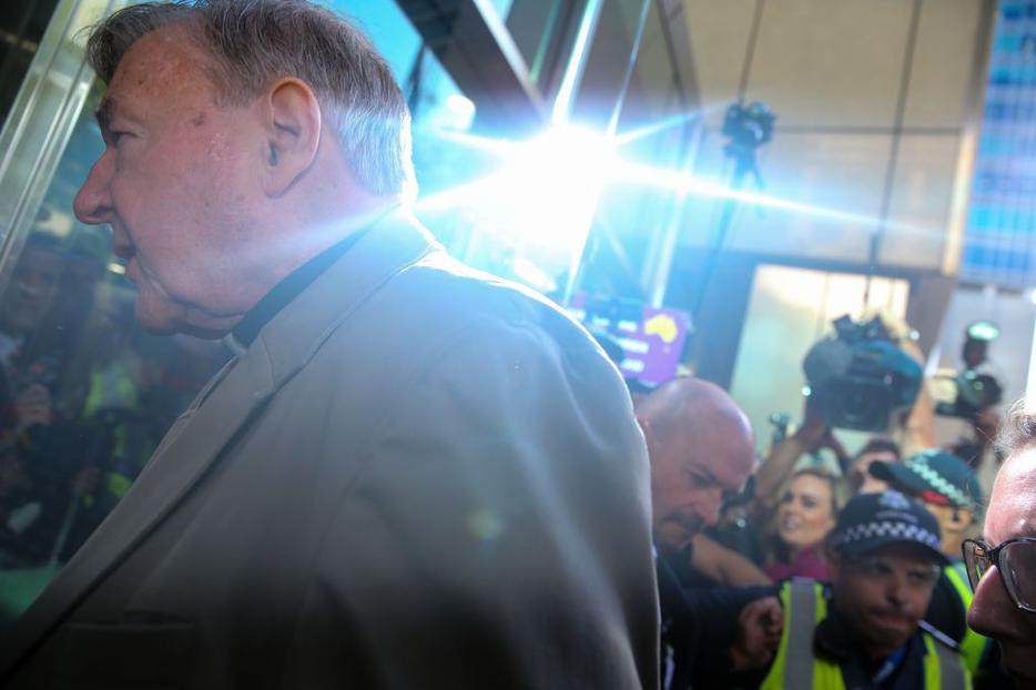 Cardinal George Pell makes his way to court in Melbourne, Australia, Feb. 27.