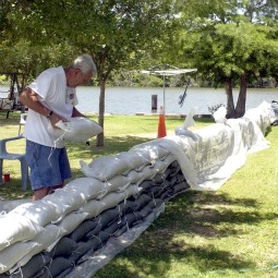 Dan McCloy places sandbags around his home located on Bayou Melhomme in Stephensville, La., May 14. This small community north of Morgan City is in the flood plain of the Morganza spillway. With the continuing release of water from the swollen Mississippi through the spillway, the river was expected to top out at 45 feet at Baton Rouge, La.