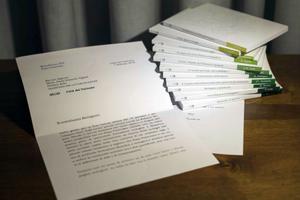 A letter by retired Pope Benedict is seen in this photo, released March 13, that the Vatican admitted
was doctored, by blurring its final two lines, where retired Pope Benedict begins to acknowledge that he
didn’t read an 11-volume set of books about Pope Francis’ theology, seen at right, and doesn’t have time to comment
on them. The Vatican announced March 21 that the head of the Vatican’s communications department,
Msgr. Dario Viganò, had resigned over a scandal about the letter, indicating that he mischaracterized it in public
and then digitally manipulated it in the photograph sent to the media.