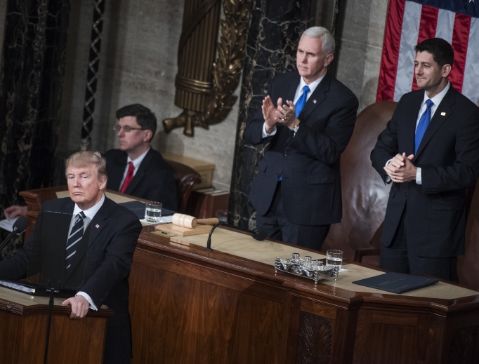 President Donald Trump addresses a joint session of Congress in the Capitol House Chamber, as Speaker Paul Ryan, R-Wis., right, and Vice President Mike Pence look on, Feb. 28. 