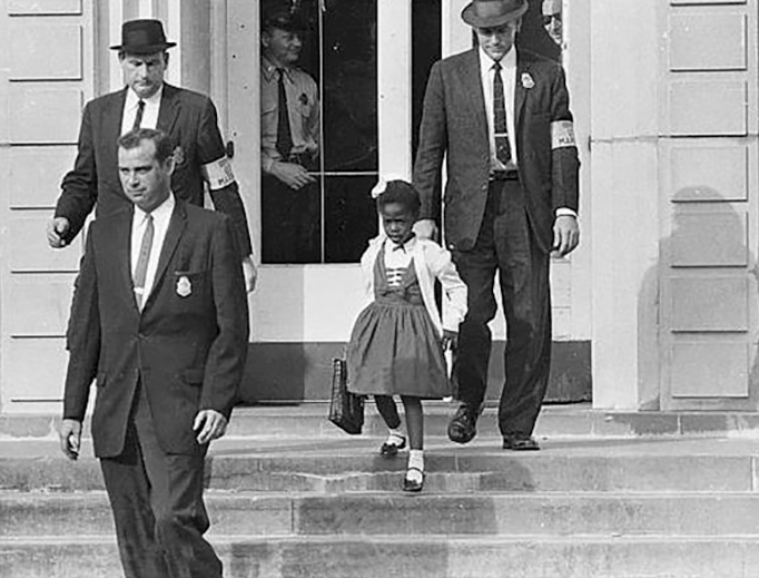 U.S. Marshals protect Ruby Bridges as she leaves her New Orleans school in 1960.