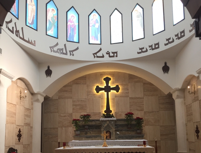 Above, a church in Karamlesh has faced displacement of its parishioners; below, Father Benham Benoka, parish priest in Bartella, and Father Benedict Kiely (r), who visited Iraq in the first week of January.