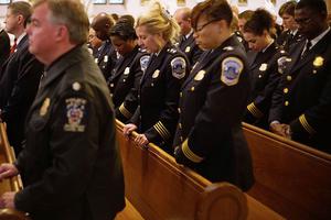 Police attend the annual Blue Mass at Saint Patrick's Catholic Church, May 5, 2015, in Washington, D.C. The Blue Mass is held annually for those in law enforcement and first responders.