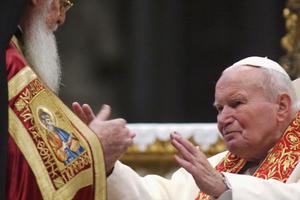 Pope John Paul II embraces Orthodox Patriarch of Constantinople Bartholomew I during an ecumenical celebration at St. Peter’s Basilica on Nov. 27, 2004, in Vatican City. The Pope also returned relics of two early Christian saints, aiming to establish unity among the two Christian churches. 