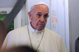 Pope Francis speaks aboard a flight from Italy to Ecuador July 5, 2015.