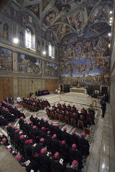 Synod participants pray Oct. 18 in the Sistine Chapel.