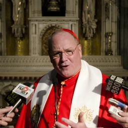 Cardinal Timothy Dolan speaking to reporters about the HHS controversy outside St. Patrick Cathedral in New York City.