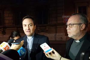 Fathers Eugenio de la Fuente Lora and Father Francisco Javier Astaburuaga Ossa talk to reporters June 2. 