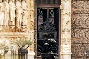  The interior of Notre Dame Cathedral, which suffered a devastating fire April 15, is seen through a doorway April 16.