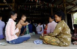 Women attend a workshop on breast-feeding at a Catholic Relief Services-supported clinic in Prey Pkosh, Cambodia, in August 2005. The workshop is part of a program that seeks to lower Cambodia's high maternal and infant mortality rates by monitoring the health of pregnant women, teaching safe birthing practices and encouraging new mothers to breast-feed and have their infants vaccinated.