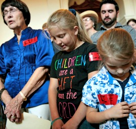 Pro-life supporters pray in the Texas State Capitol July 1 prior to the vote to prohibit abortions in Texas after 20 weeks of a woman's pregnancy.