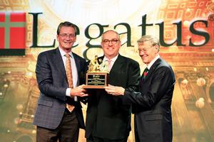 Michael Warsaw, center, was honored with the ‘Bowie Kuhn Special Award for Evangelization’ by Legatus. 