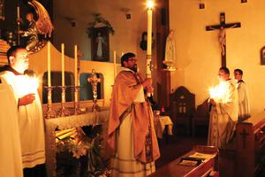 The Franciscan Missionaries of the Eternal Word celebrate the Easter vigil each year — Father Leonard Mary is shown above in 2016 and images of the 2018 vigil are below — with the reverence and hope the liturgy fosters for the faithful. 