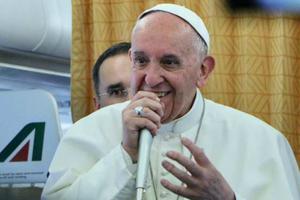 Pope Francis aboard the papal plane on April 29.
