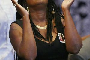 A mourner looks upwards during the June 25 funeral service of Ethel Lance, 70, one of the nine victims of a mass murder at Emanuel African Methodist Episcopal Church in Charleston, S.C.