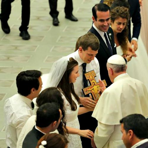 Pope Francis blesses newly married couples at the general audience in Vatican City on Aug. 5.
