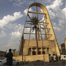 Iraqi policemen stand guard outside Our Lady of Salvation church, where gunmen held hostages, in Baghdad November 1, 2010. An unclear number of Iraqi Catholics died on Sunday when police stormed the Baghdad church where gunmen were holding dozens of parishioners hostage, threatening to kill them if al Qaeda prisoners were not released.