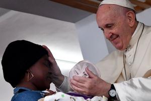 Pope Francis blesses a mother with a baby during his visit to Zimpeto hospital in Maputo, Mozambique, Sept. 6.

 