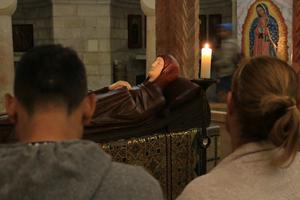 Faithful pray inside Dormition Abbey on Mount Zion.
